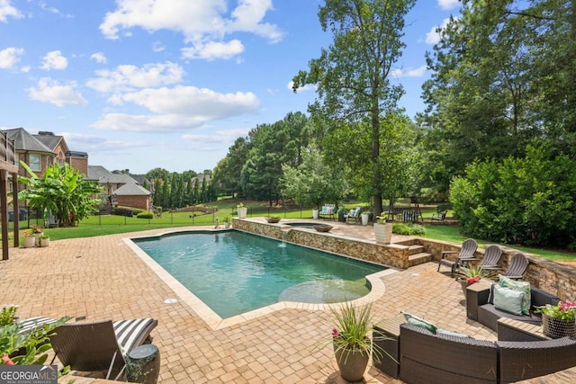 view of swimming pool with an in ground hot tub, a yard, and a patio area