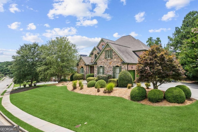 view of front of home with a front lawn