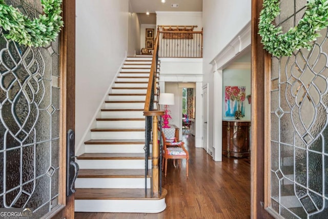 foyer with dark hardwood / wood-style floors