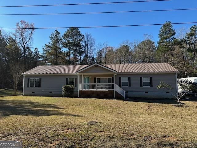 single story home with a front yard and a porch