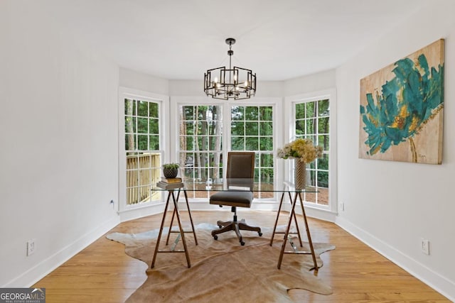 hall with light wood-type flooring, vaulted ceiling with beams, and an inviting chandelier