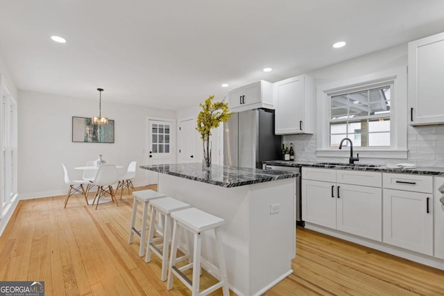 office featuring light hardwood / wood-style flooring and a notable chandelier