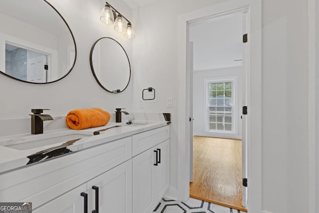 bathroom with vanity and wood-type flooring