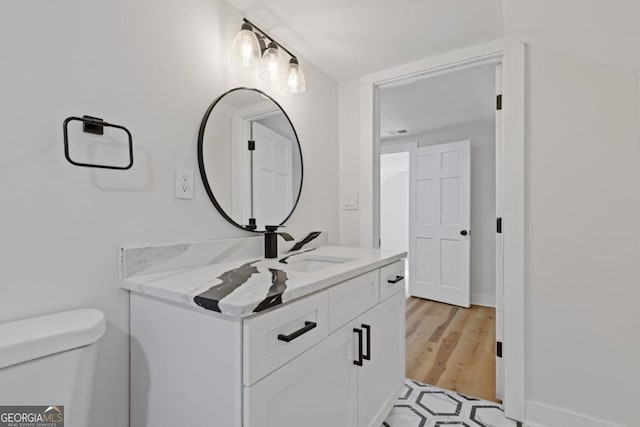 empty room with ceiling fan and light hardwood / wood-style flooring