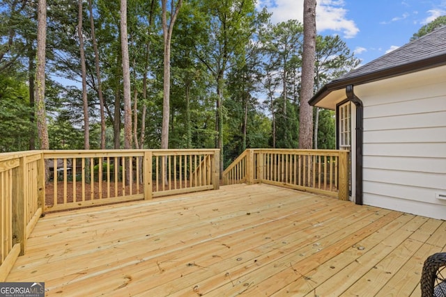 unfurnished bedroom with ceiling fan, light hardwood / wood-style flooring, and ensuite bath