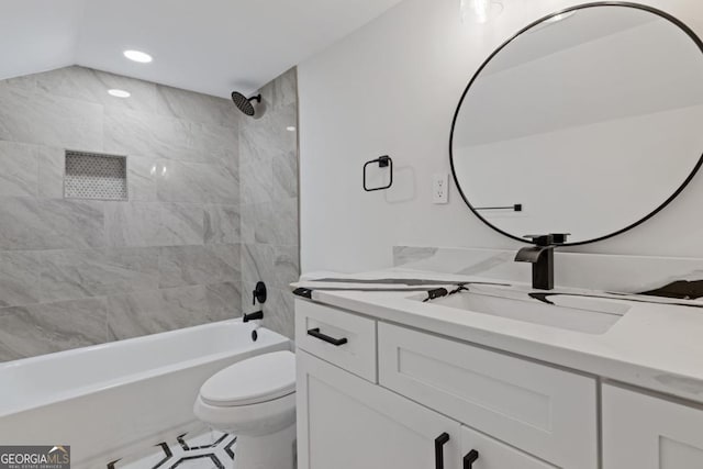 bathroom featuring vanity, ceiling fan, tiled shower, and toilet