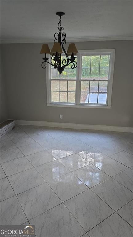 unfurnished dining area with ornamental molding and a chandelier