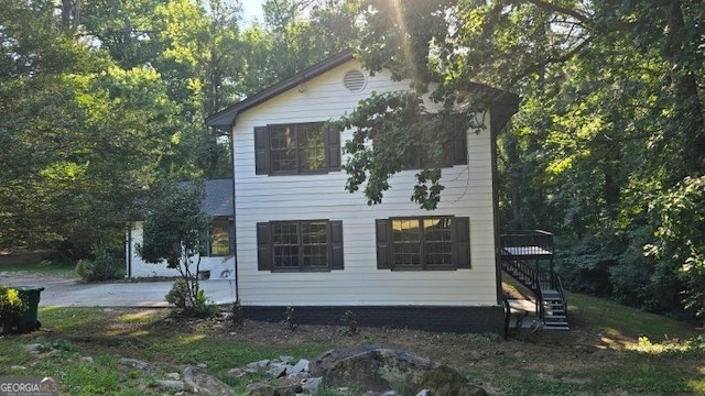 view of side of home featuring a patio area