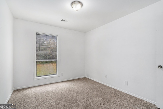 unfurnished room with carpet flooring