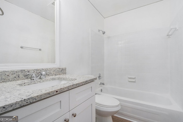 full bathroom featuring bathtub / shower combination, vanity, and toilet