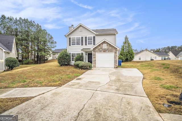 front of property with a garage and a front lawn