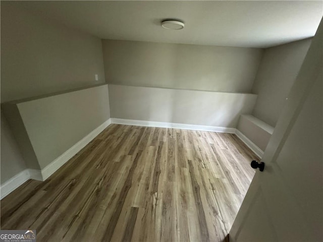 unfurnished room featuring hardwood / wood-style floors