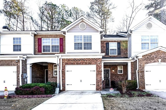 townhome / multi-family property featuring a garage