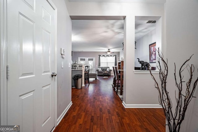 hall featuring dark wood-type flooring