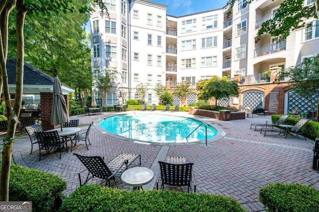 view of pool featuring a patio