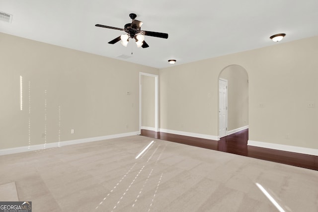 empty room featuring ceiling fan and carpet floors