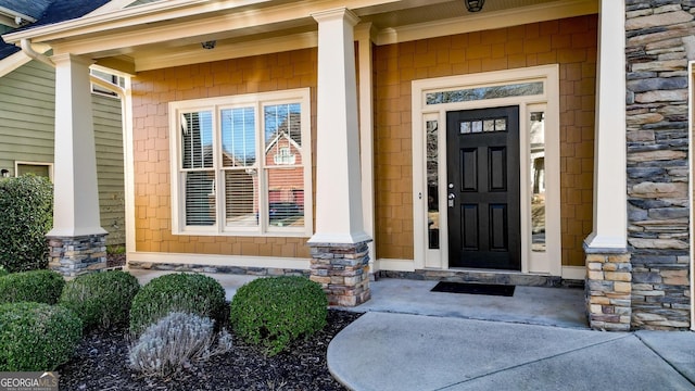 doorway to property featuring covered porch