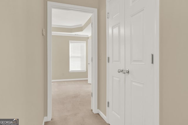 corridor with light colored carpet and ornamental molding