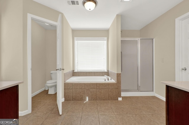 full bathroom featuring tile patterned floors, vanity, toilet, and separate shower and tub