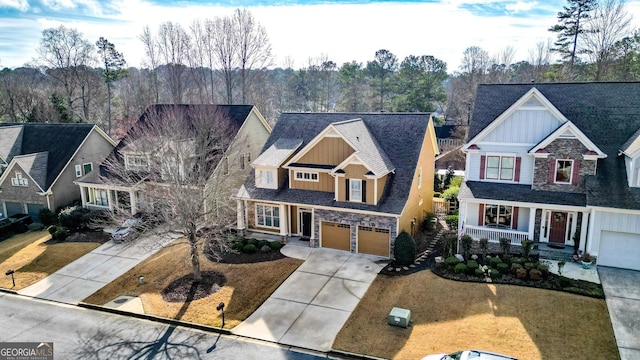 view of front of property featuring covered porch and a garage