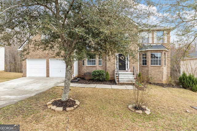 view of property hidden behind natural elements featuring an attached garage, a front lawn, concrete driveway, and brick siding