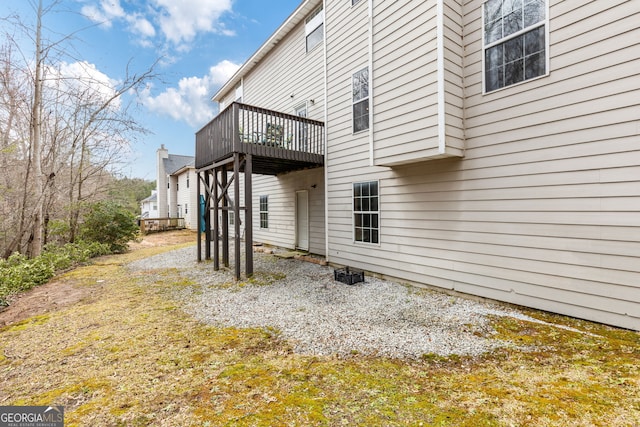 view of side of property with a wooden deck