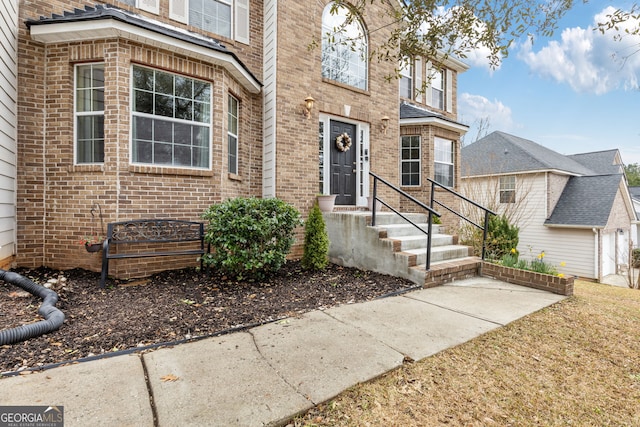 view of front of house featuring brick siding