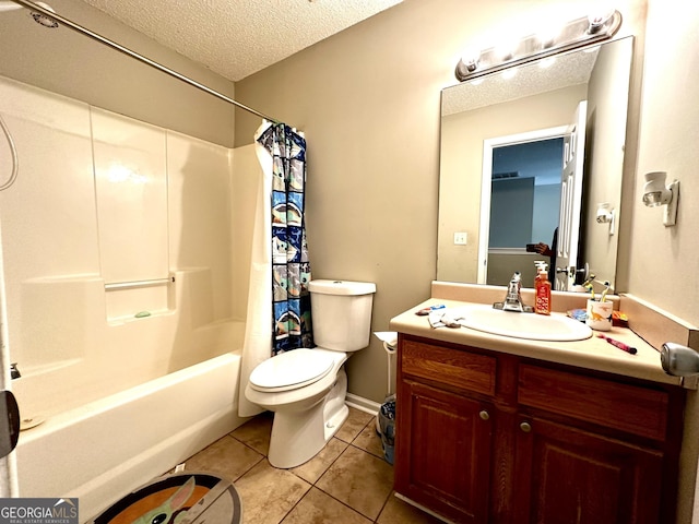 full bathroom featuring tile patterned flooring, toilet, vanity, a textured ceiling, and shower / tub combo with curtain