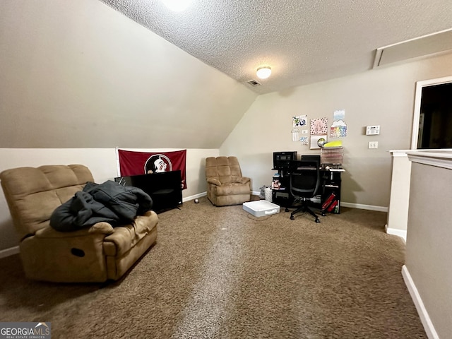 office with a textured ceiling, carpet floors, and lofted ceiling