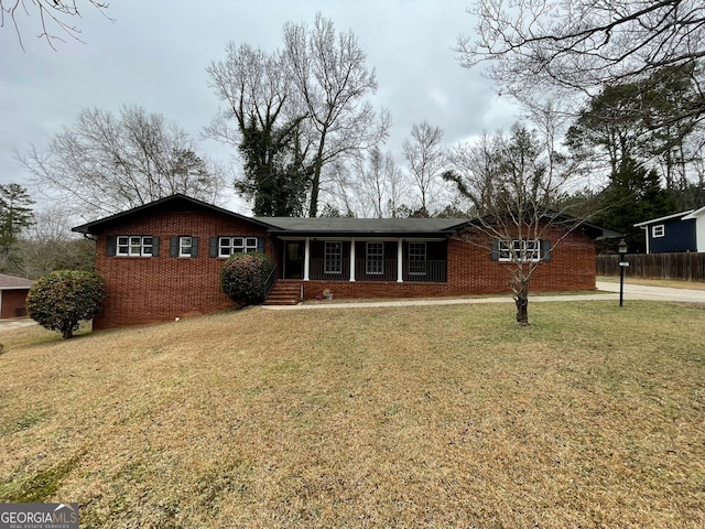 view of front of home featuring a porch and a front lawn