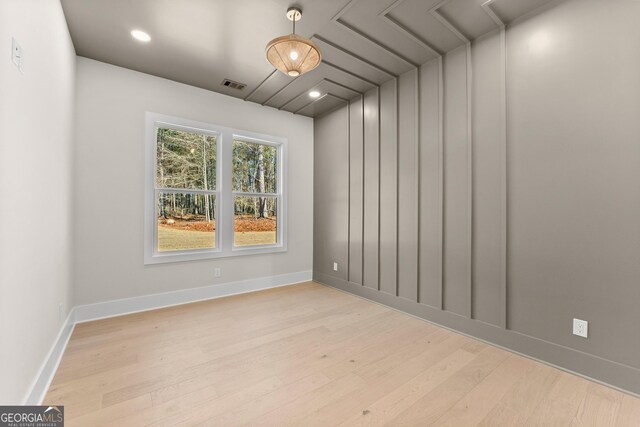 empty room with light hardwood / wood-style floors