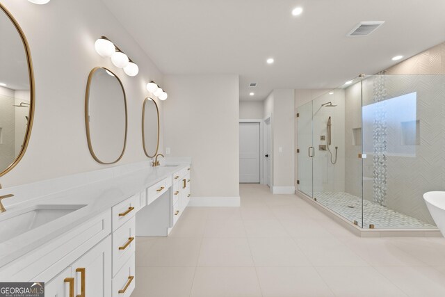 bathroom with tile patterned flooring, vanity, and a shower with shower door