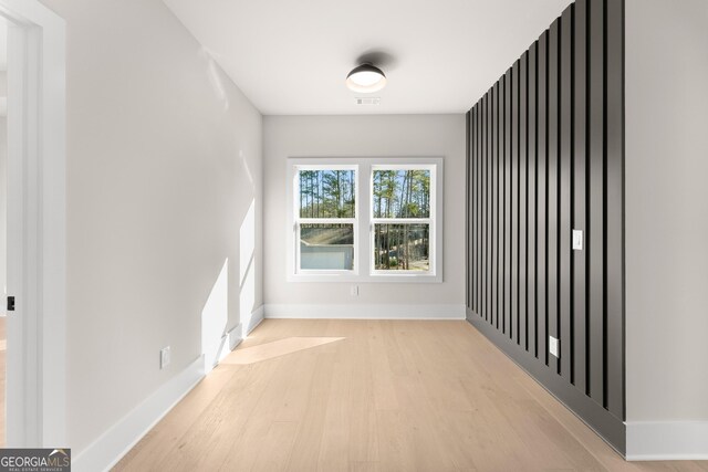 spare room with light hardwood / wood-style floors