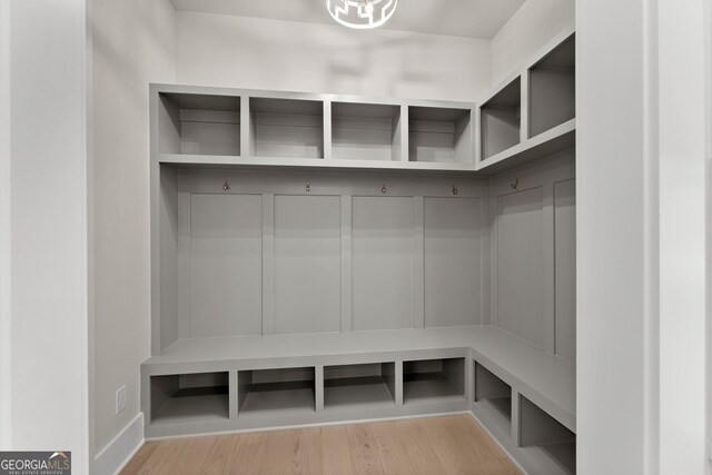 mudroom with light hardwood / wood-style floors