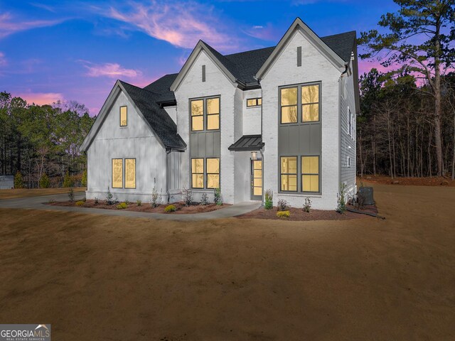 view of front of home with cooling unit