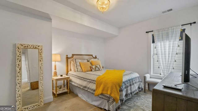 bedroom featuring light colored carpet