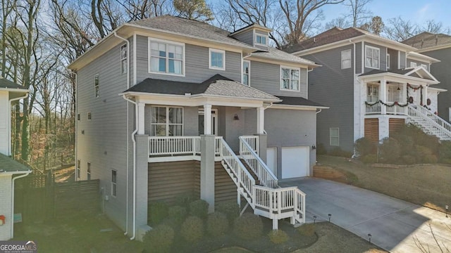 view of front of property featuring a garage and covered porch