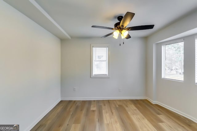 unfurnished room featuring light hardwood / wood-style flooring and ceiling fan