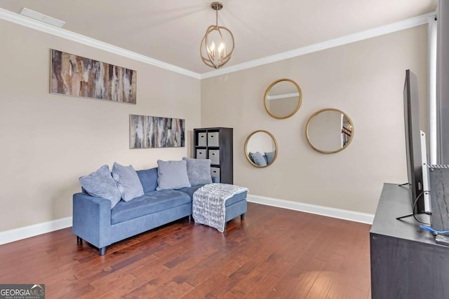 living area with crown molding, dark hardwood / wood-style flooring, and a chandelier