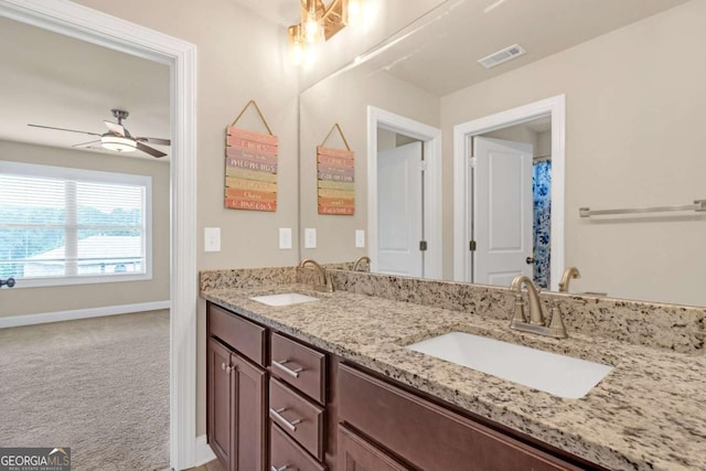 bathroom featuring vanity and ceiling fan