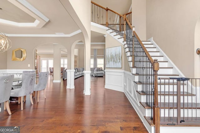 entrance foyer featuring dark hardwood / wood-style flooring and ornamental molding