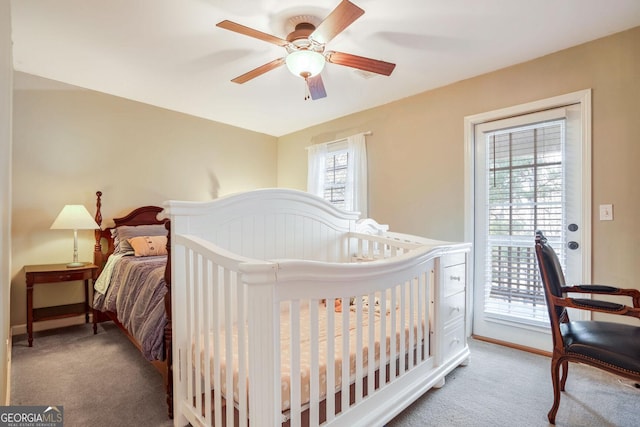 bedroom with carpet, ceiling fan, and access to outside