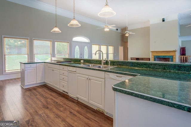 kitchen featuring dishwasher, sink, white cabinets, and ceiling fan