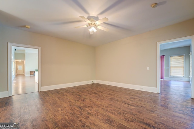 spare room featuring hardwood / wood-style floors and ceiling fan