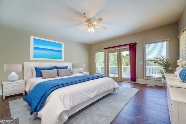 bedroom featuring access to outside, ceiling fan, and dark wood-type flooring