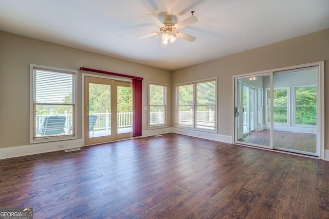 spare room with ceiling fan and dark hardwood / wood-style floors