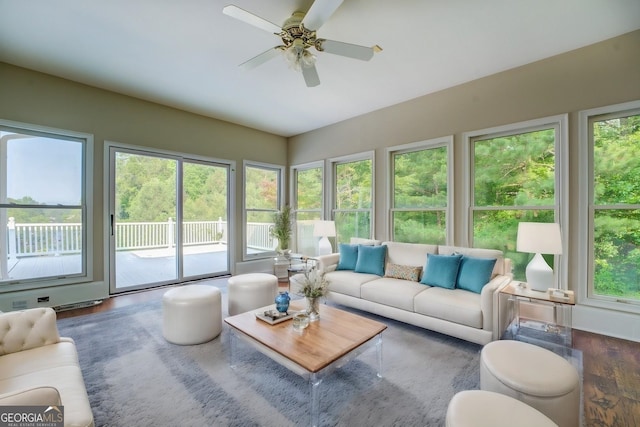 sunroom / solarium featuring a wealth of natural light and ceiling fan