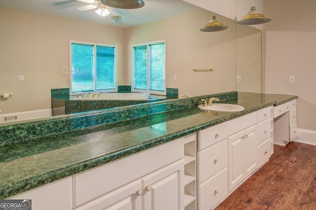 bathroom with hardwood / wood-style floors, vanity, and ceiling fan