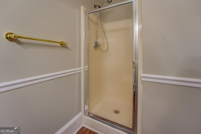 bathroom with a shower with shower door