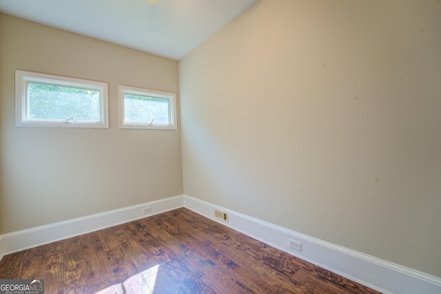 empty room featuring dark wood-type flooring